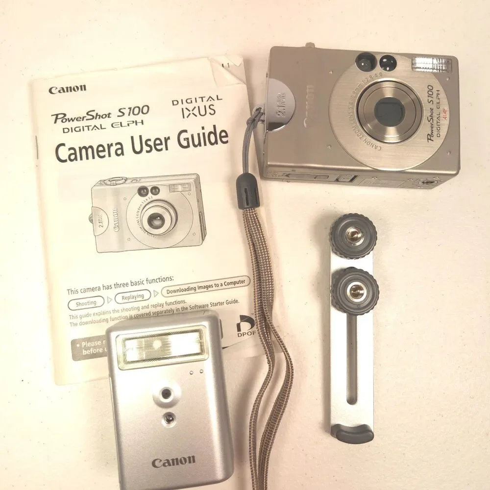 Canon PowerShot S100 Digital ELPH Camera Bundle Case Flash Battery Tested